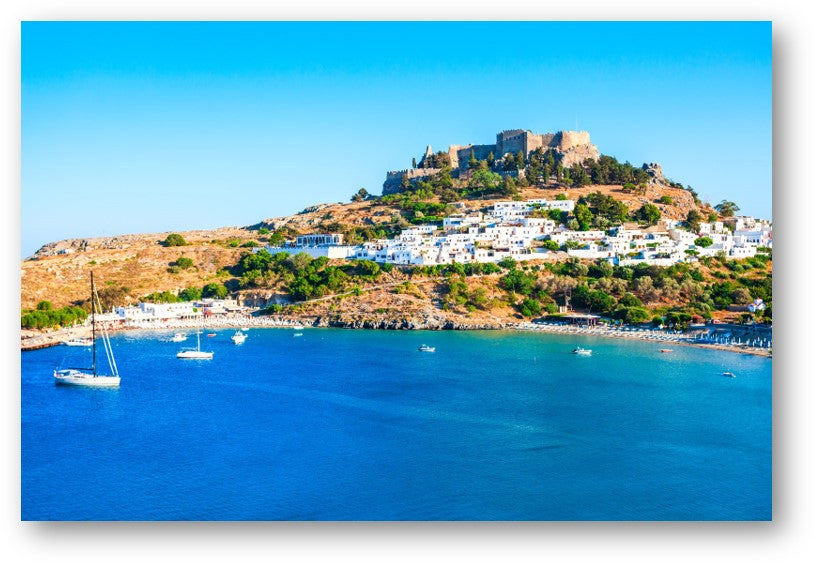 Turquoise bay and hillside fortress in Rhodes, Greece